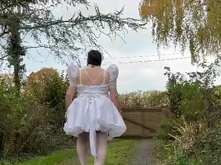 Dressed in a short wedding dress to play the maid for a day