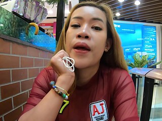 Asian babe flaunts phony boobies in skimpy attire while getting a naughty hand job under the sun
