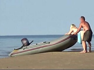 MILF blonde beach babe takes it in the sand