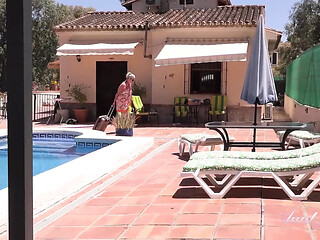 Hotty older woman gives handjob and shows off big tits poolside