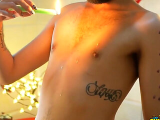 Playing with some colorful candles to the sound of hristmas carols