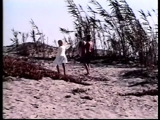 Two blondes with great bodies are fucking sensually on the beach
