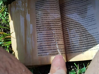 Pissing on a Book Outdoors (slow motion)