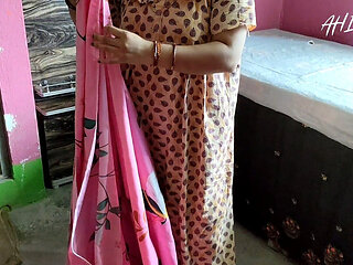 Indian Girl Folding Clothes in Her Bedroom