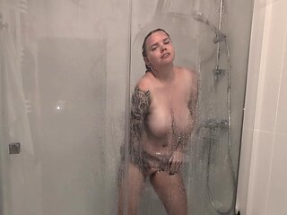 The Girl With Big Tits Takes A Shower And Masturbates