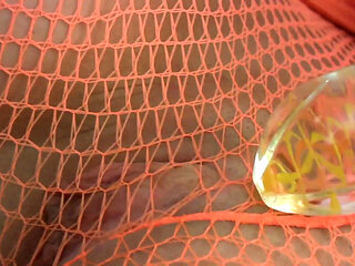 Babe in fishnet outfit rips pantyhose and puts a dildo in her shaved cunt