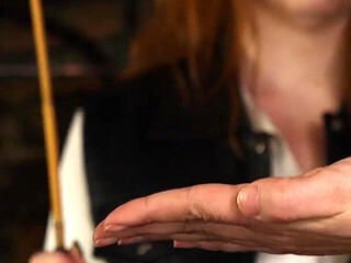 Slave Mila Endures 24 Cold-hearted Hand Caning Strokes From Mistress Roxy