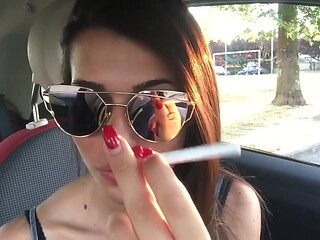 Cute teen Petra smoking in the car