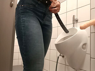 Public dildo masturbation in a men's restroom
