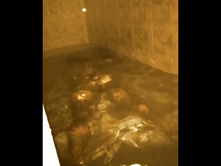 Bandar Sissy masturbates in his bathtub at night, attempting to self suck the hard cock.
