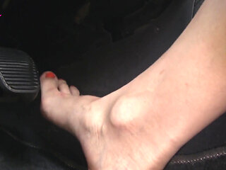 Nyllady with Her Bare Foot on Gas Pedal Driving