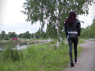 Walking in full leather outfit and heels.