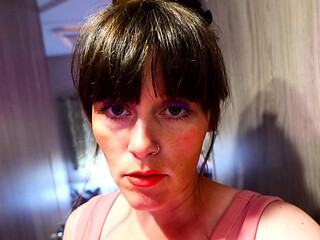 Pink labia close up of naive brunette playing with her name