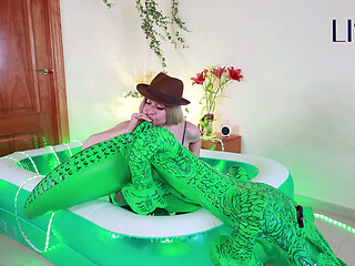 Lissa Brown, safari explorer, inflating an inflatable croc