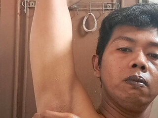 Exotic skinned Asian adult man shaving