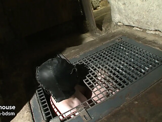Ruthless mistress breaks her masked slaves in the dungeon