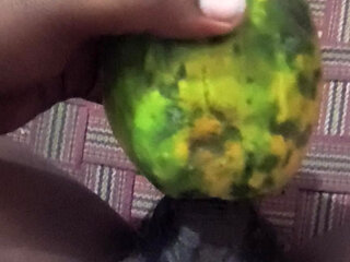 An Indian man enjoys the pleasure of inserting his penis into a papaya fruit
