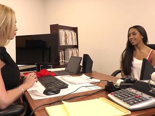 Two hot chicks are having fun in the office with each other