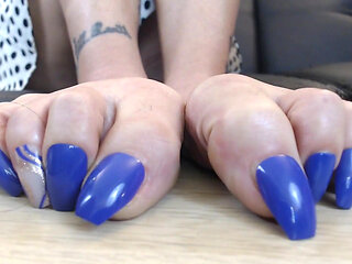 Closeup super long purple toenails