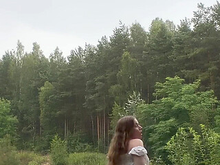 Teen Shows Tits and Asshole During a Storm in the Forest