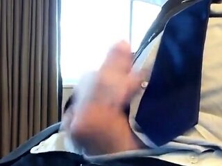 Suited Silver Fox Jerks Off Solo