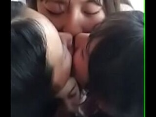 Lesbian Asian girlfriends enjoy a hot kissing party at the hotel