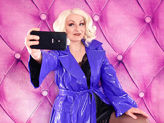 Process of selfie - hot curvy Arya Grander - backstage and teasing in shiny PVC coat
