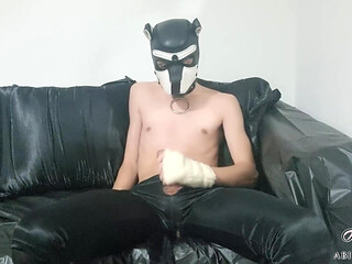 Rubber Twink Pup Jerks Off In His Rubber Couch