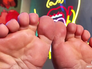 My bare wrinkled soles and toes on the table closeup