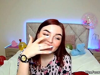 Red-haired cam girl performs solo show for her fans