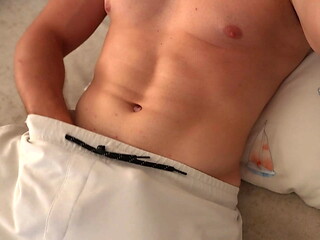 Strong guy covers himself in cum after masturbation