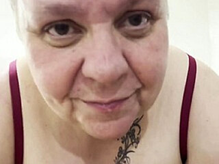 French mature BBW with tattoos and short hair enjoys oral and anal sex
