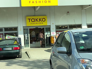 In a super short mini skirt and a thoughtful bodysuit while shopping