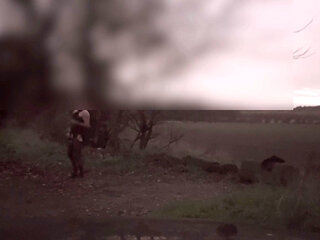 Wanking  in body stocking dodging cars that pass by