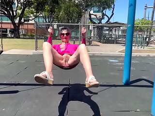Playing on a swing in Kaimuki. (BTW, this is NOT at a school - and there was nobody nearby.)