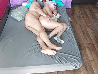 Sensual massage of a hot couple with oil on the body. Foreplay in the bedroom with an amateur couple.