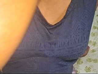 Asian MILF with natural big tits enjoys her husband's cock in their home.