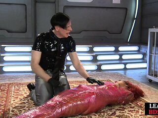 Wrapped sexy babe dominated by master