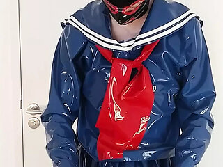 Putting on blue latex Japanese sailor uniform skirt and shirt, rubber maid stockings