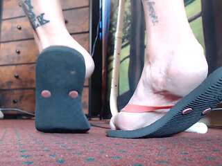 Very worn black flipflops