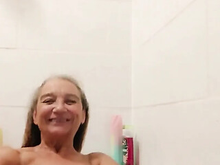 Naked voluptuous woman gets washed