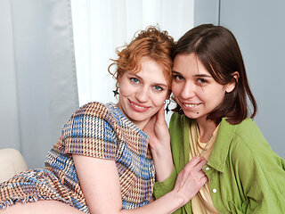 Slender redhead takes a break for some kitchen lesbiansim