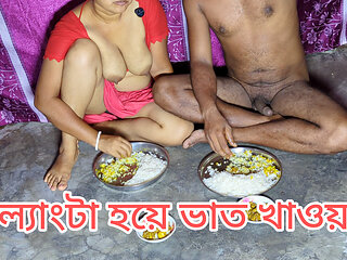 Indian husband and wife eat food