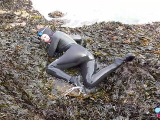 Rubbery Beach Encounter: Lucy's Neoprene Pussy Play with Stranger