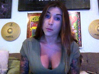 Busty curly brunette with big boobs fucks on couch