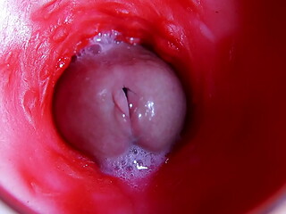 A huge cock inside a wet hole spews liquid and will soon fill with milk