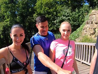 Two guys and a girl in an intense threesome sex session