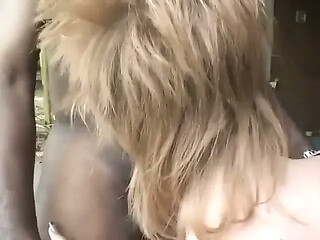Erotic stud enjoys his pole licked by a sexy babe outdoors