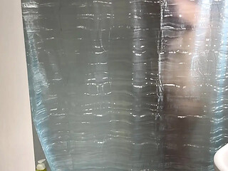 Step sister enters the bathroom for a steamy shower.