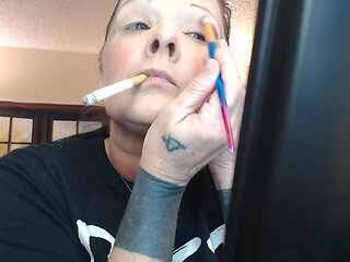 Doing make up dangling smoke